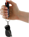 Streetwise stream pepper spray shown with safety‑lock actuator and attached key ring with keys.