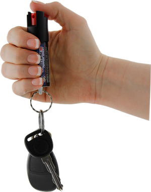 Streetwise stream pepper spray shown with safety‑lock actuator and attached key ring with keys.