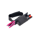 Magenta Strike‑N‑Spray Double Defender shown with attached wrist strap, highlighting the strap placement and device color.