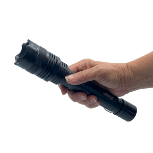 rechargeable tactical stun flashlight with a durable black metal body and integrated stun feature bwing held in hand