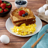Scoop of powdered eggs displayed to show texture