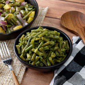 freeze‑dried green beans presented in a serving dish, displayed as part of a long‑term survival‑food assortment