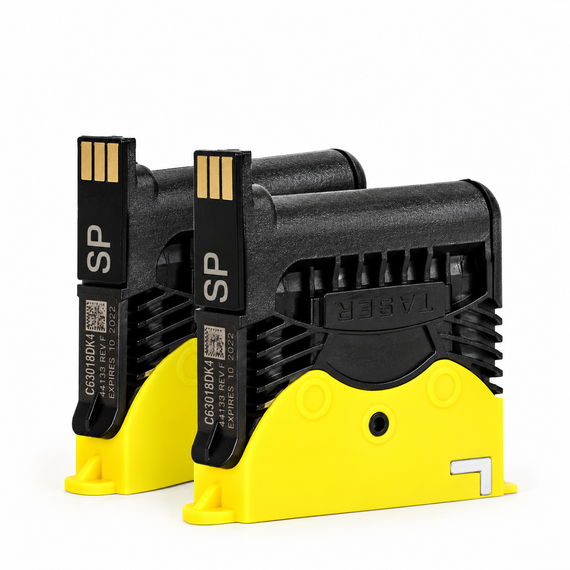 Two TASER X2 replacement cartridges with black housings, gold electrical contacts, and yellow lower sections on a white background.