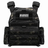 Testudo Gen 3 plate carrier in Multicam Black photographed to highlight its modular attachment zones and rugged construction for preparedness gear.