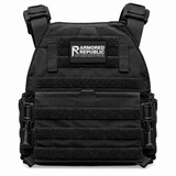 Testudo Gen 3 plate carrier in black shown with load‑bearing shoulder pads, drag handle, and laser‑cut webbing.