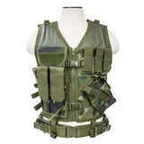 Tactical vest in woodland camouflage photographed from the side highlighting the attached pistol belt, modular webbing, and rugged construction.