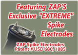 Close view of the ZAP Hike‑N‑Strike hiking staff showing the electrified stun electrodes positioned near the top of the shaft below the flashlight.