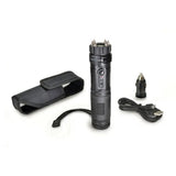 Contents layout showing the ZAP Light Extreme stun gun flashlight with spiked electrodes, charging cable, wrist strap, and included accessories arranged on a flat surface.