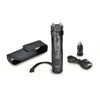 Contents layout showing the ZAP Light Extreme stun gun flashlight with spiked electrodes, charging cable, wrist strap, and included accessories arranged on a flat surface.