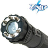 Front view of the ZAP Light Extreme stun gun flashlight showing the spiked metal electrodes surrounding the light lens.